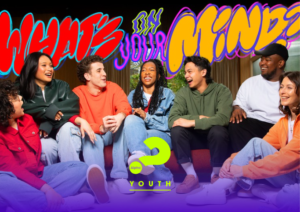 A group of six youth seated in a semi-circle, smiling and laughing. A caption asks, 'What's on your mind?'